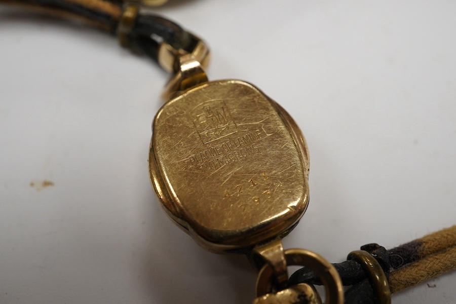 A lady's steel and gold plated Omega manual wind wrist watch, on an associated leather strap, together with a lady rolled gold Bucherer wrist watch. Condition - poor